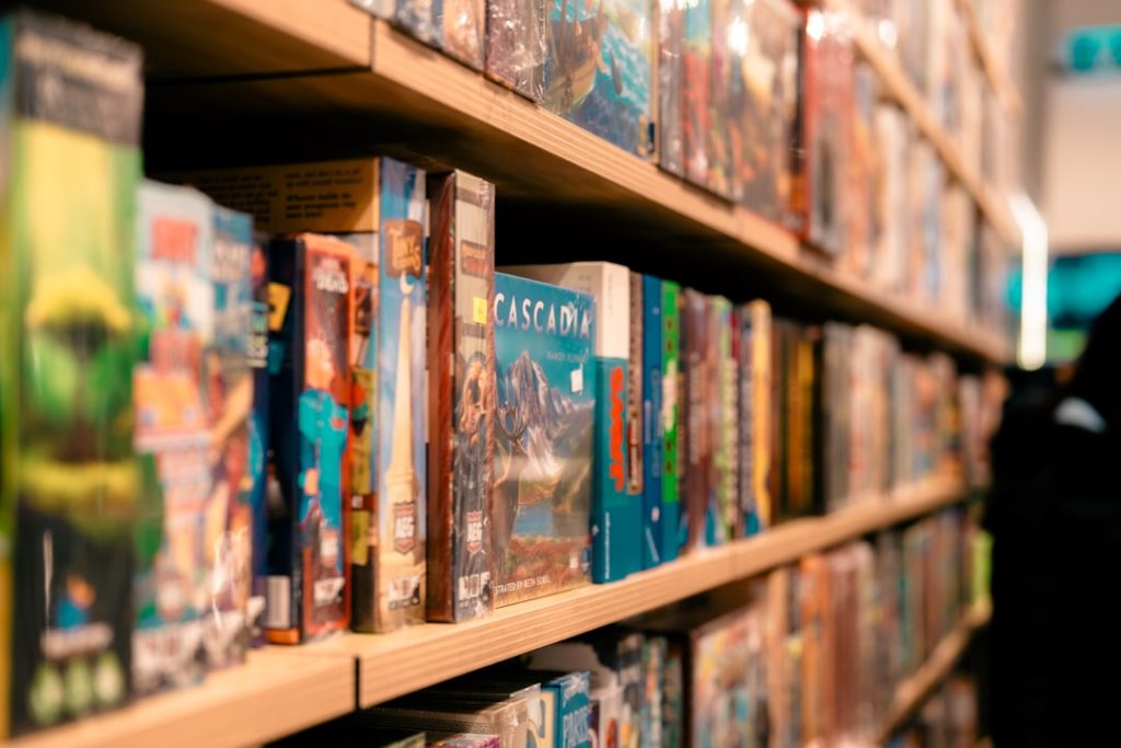 a-row-of-books-sitting-on-top-of-a-wooden-shelf-4rfz-d2echa